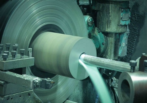 Continuous cast iron cylinder being drilled